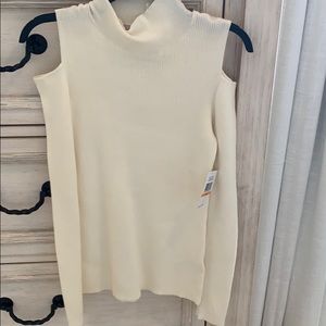 Cream colored turtle-neck
